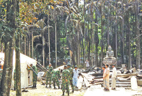 Bangladesh police arrest 300 people for attacks on Buddhist temples